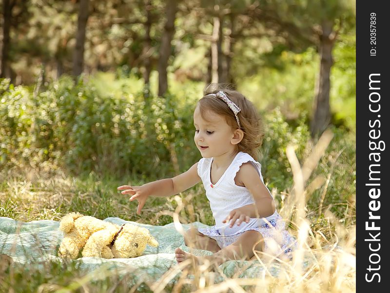 Cute little girl smiling in a park