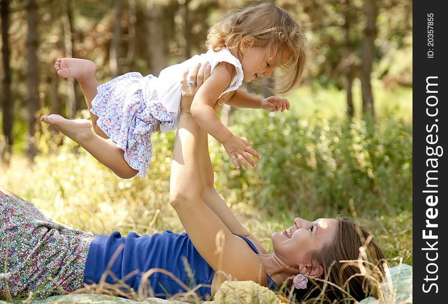 Little girl and mother in the park.