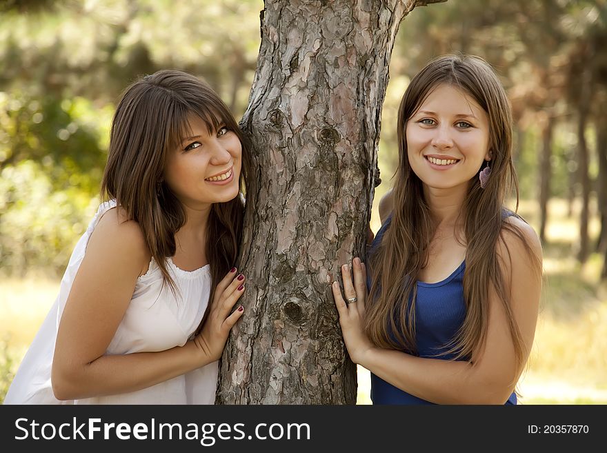 Two Happy Sisters At The Park