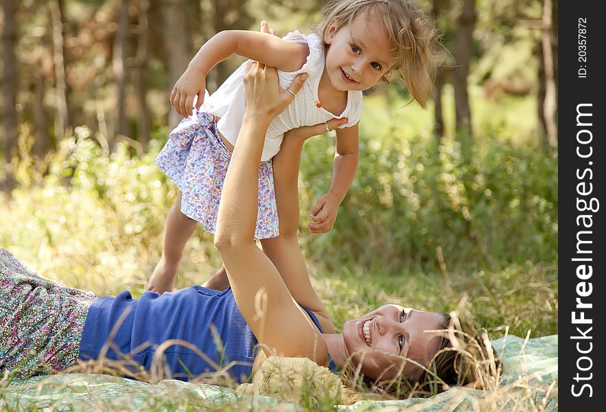 Little girl and mother in the park