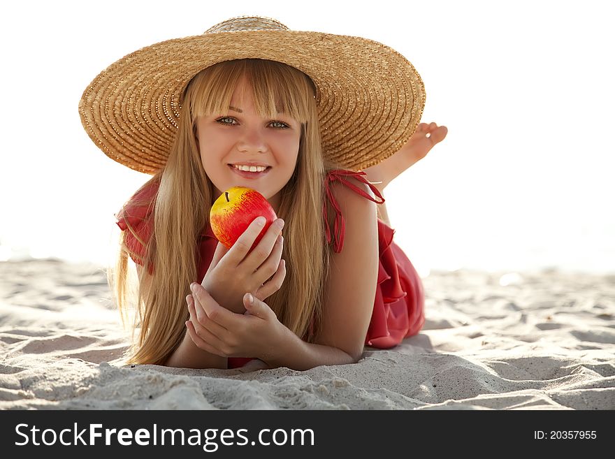Beautiful girl in hat at beach. Outdoor photo.