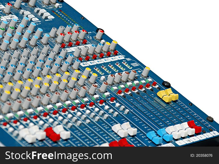 Closeup of an analog audio mixing board isolated in selective focus. Sliders with several channels and push buttons. Closeup of an analog audio mixing board isolated in selective focus. Sliders with several channels and push buttons.