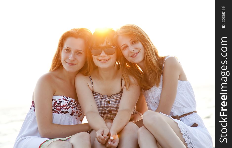 Portrait of three beautiful girls at the beach.