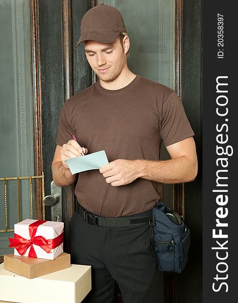 Delivery man making a notice. Delivery man making a notice