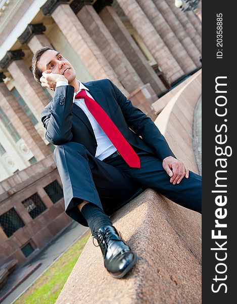 Young successful businessman portrait in modern downtown. Young successful businessman portrait in modern downtown