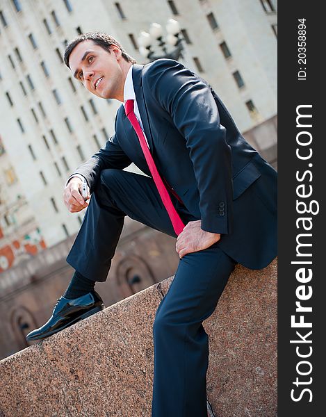 Young successful businessman portrait in modern downtown. Young successful businessman portrait in modern downtown