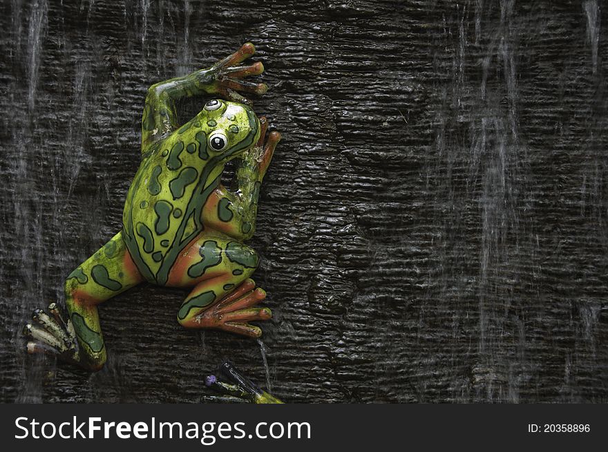 Frog statue with water flow