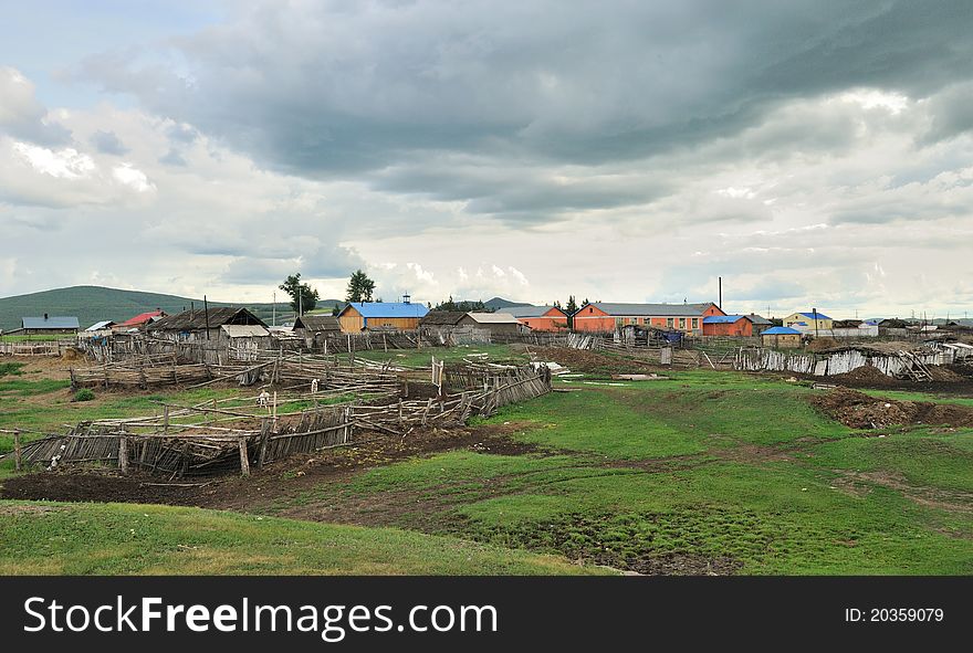 A small village in the valley, under the setting sun, Inner Mongolia province, China.