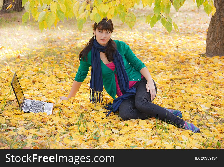 Autumn landscape. beautiful young girl resting in yellow autumn leaves. Autumn landscape. beautiful young girl resting in yellow autumn leaves