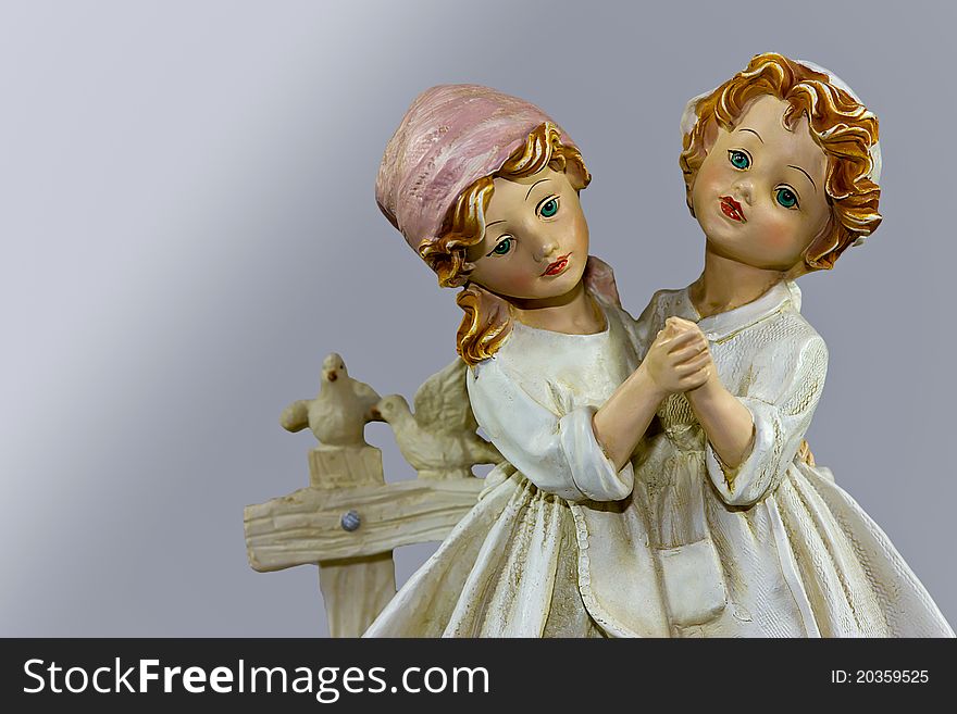 Picture of porcelain figure two sisters dancing. Isolated.
