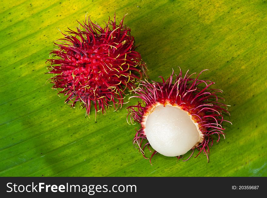 Rambutan on green banana leaf. Rambutan on green banana leaf