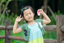 Chinese Girl With Lotus Leaf Hat Stock Image