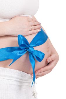 Pregnant Belly With Blue Ribbon Stock Photo