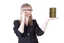 Woman Talks On The Phone Holding Coins Royalty Free Stock Photos