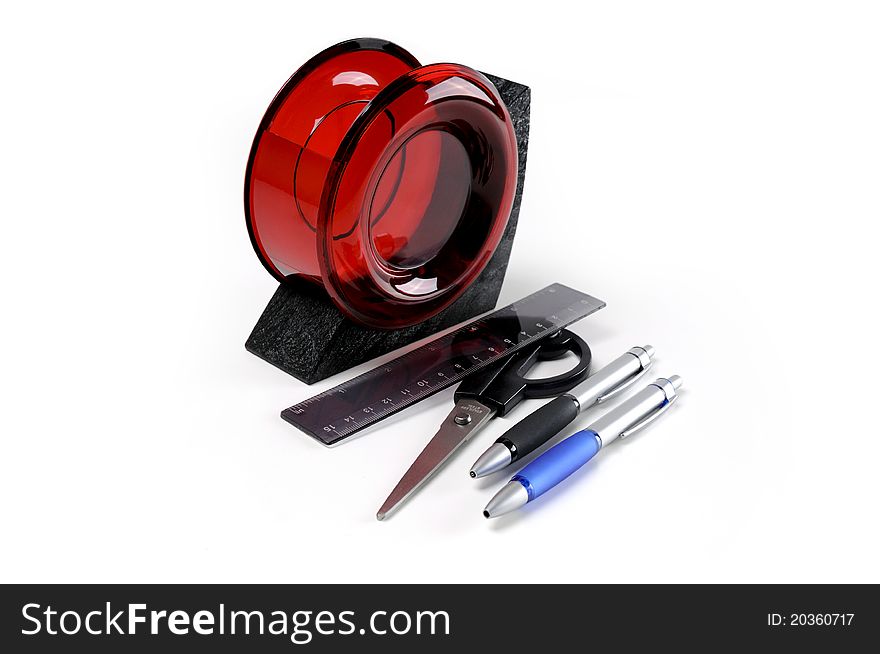 Black and red plastic desk organizer with office tools