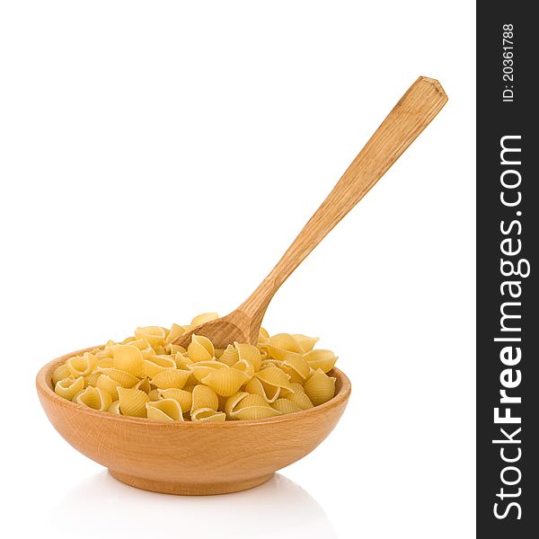 Raw pasta and wooden spoon isolated on white background