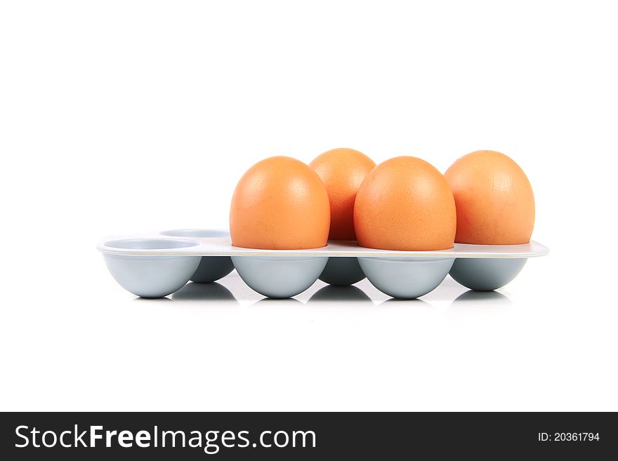 Eggs in holder isolated on white background