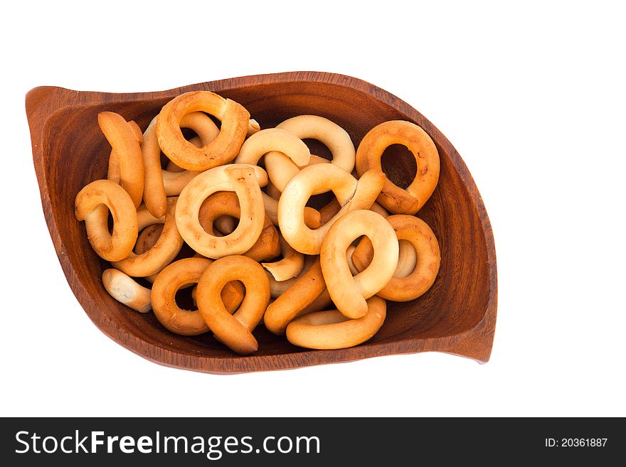Bagels on a wooden plate isolated on a white background