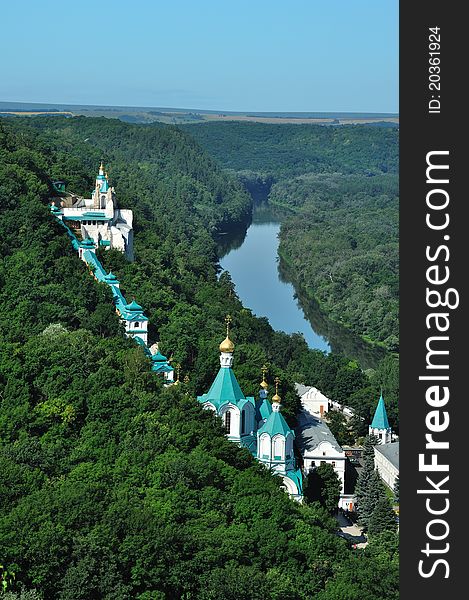 Monastery on the river. Part of monastery on the mountain of chalk.