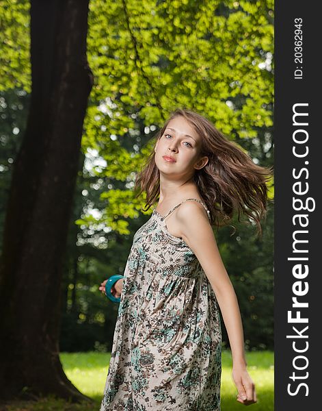 Young Student dancing on the clearing in the forest