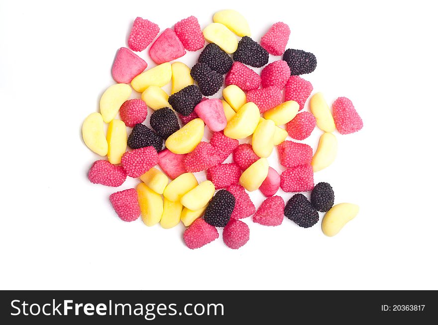 Close up of multi color jelly beans on a white background