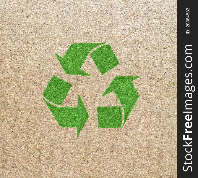 Brown corrugated cardboard sheet background with recycled sign