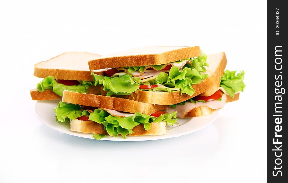 Tasty sandwiches on the plate isolated over white background