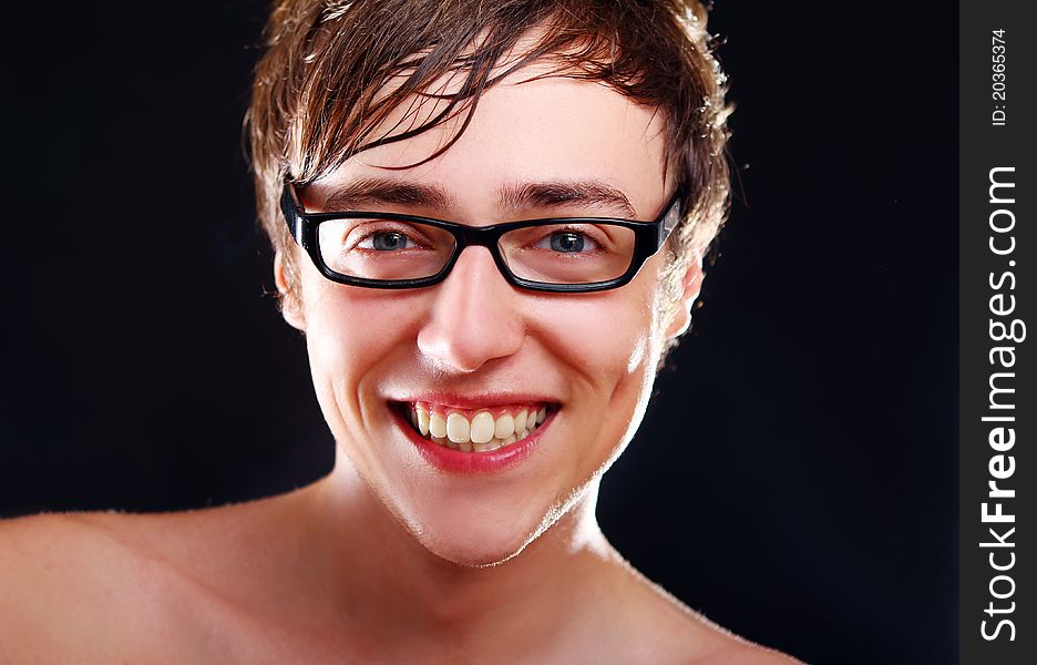 Young smiling guy in glasses