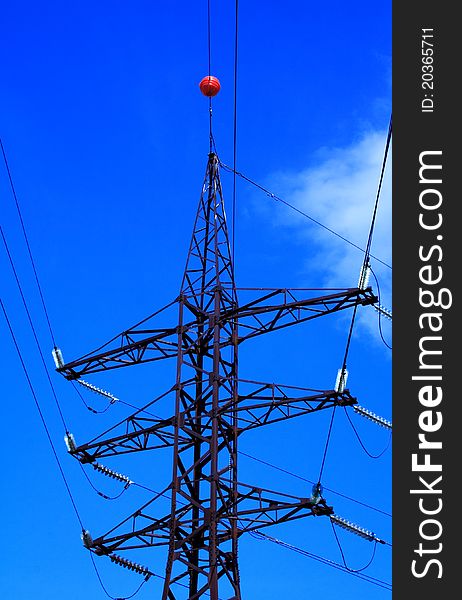 Foto of voltage tower at summer day