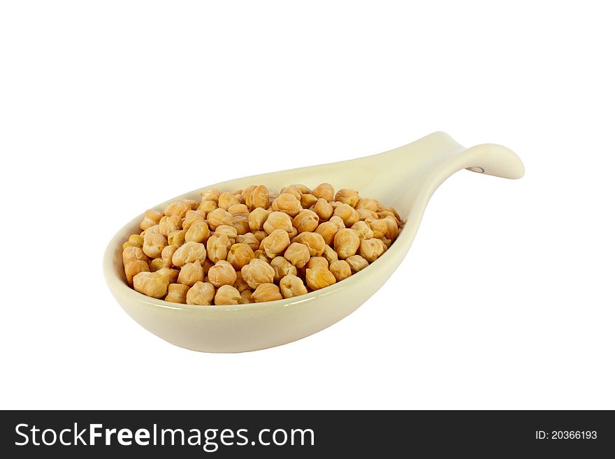 Chickpeas in porcelain spoon isolated on white