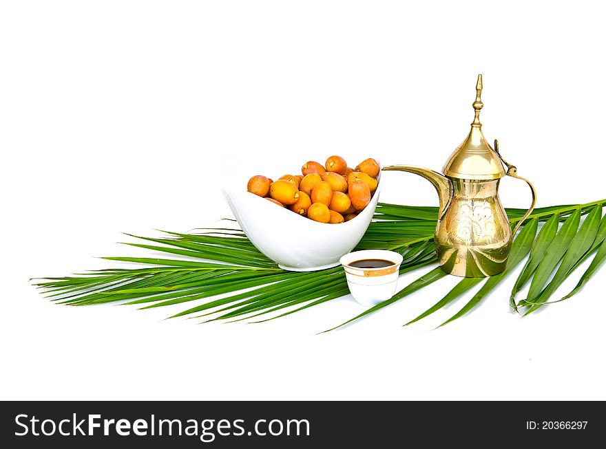 Arabic coffee pot with date fruits