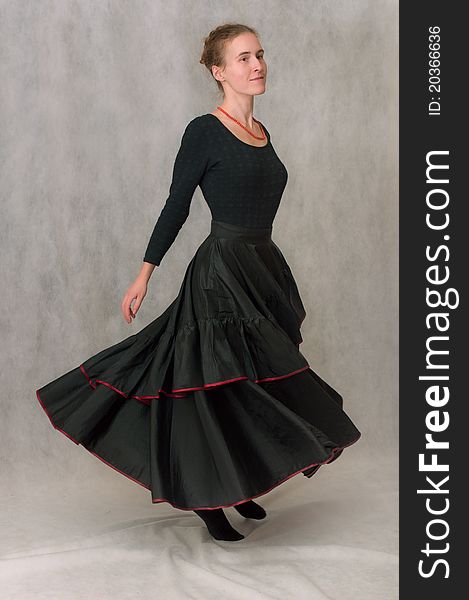 Dancing girl in long black skirt go round. Dancing girl in long black skirt go round