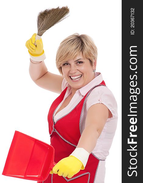 Happy young housewife holding dustpan and broom - isolated on white background