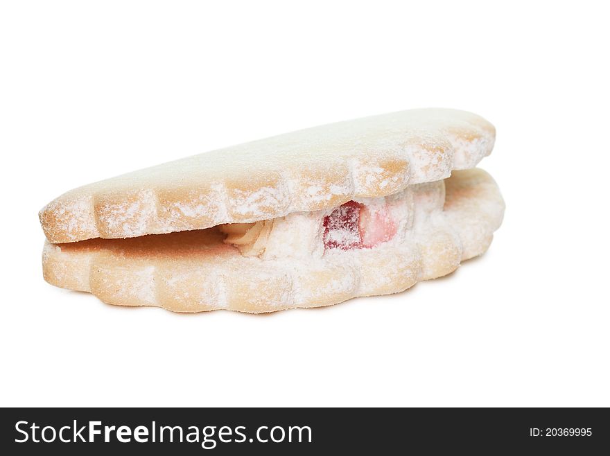 Single pastry with cream over white background