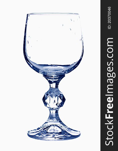 Empty wine glass in blue tones isolated over white