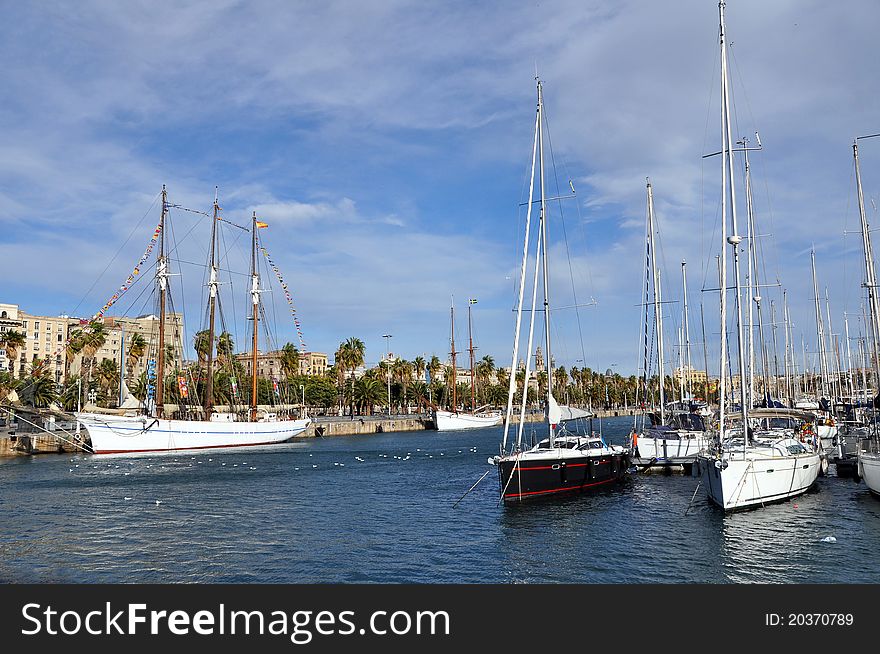 A row of yachts at Port Vell in Barcelona. A row of yachts at Port Vell in Barcelona.