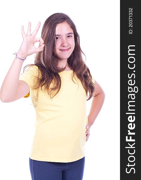 Beautiful and happy young girl doing Ok gesture