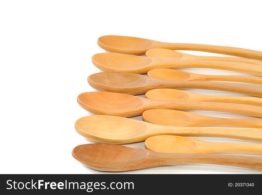 Assortment of handmade wooden spoons, isolated on a white background