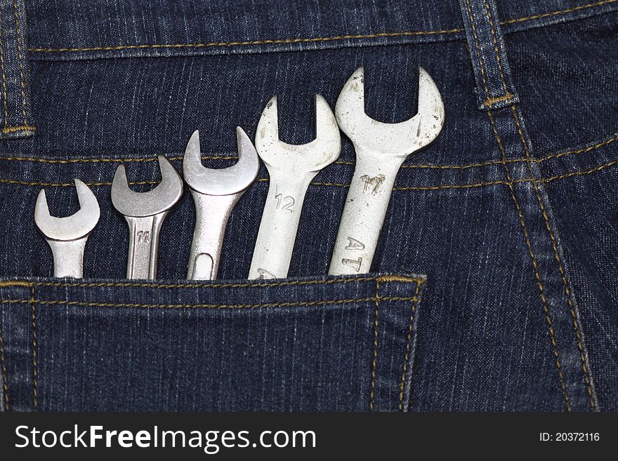 Many size of wrenches on jean. Many size of wrenches on jean