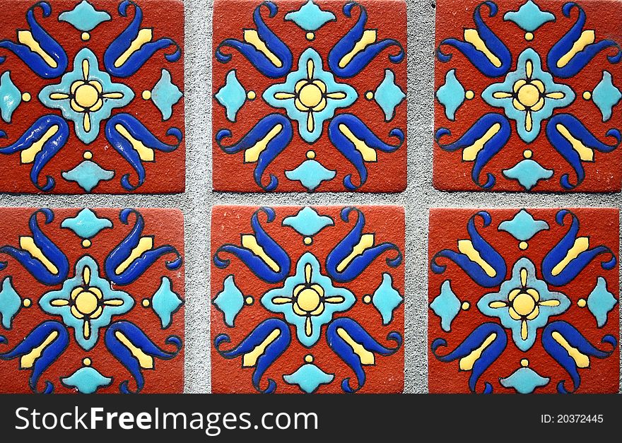 Six different colorful tiles, of the same design are shown covering the whole frame. Six different colorful tiles, of the same design are shown covering the whole frame.