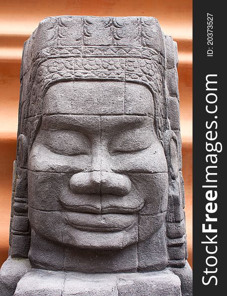The statue's face. Stone carving Asian sculpture. The statue's face. Stone carving Asian sculpture.