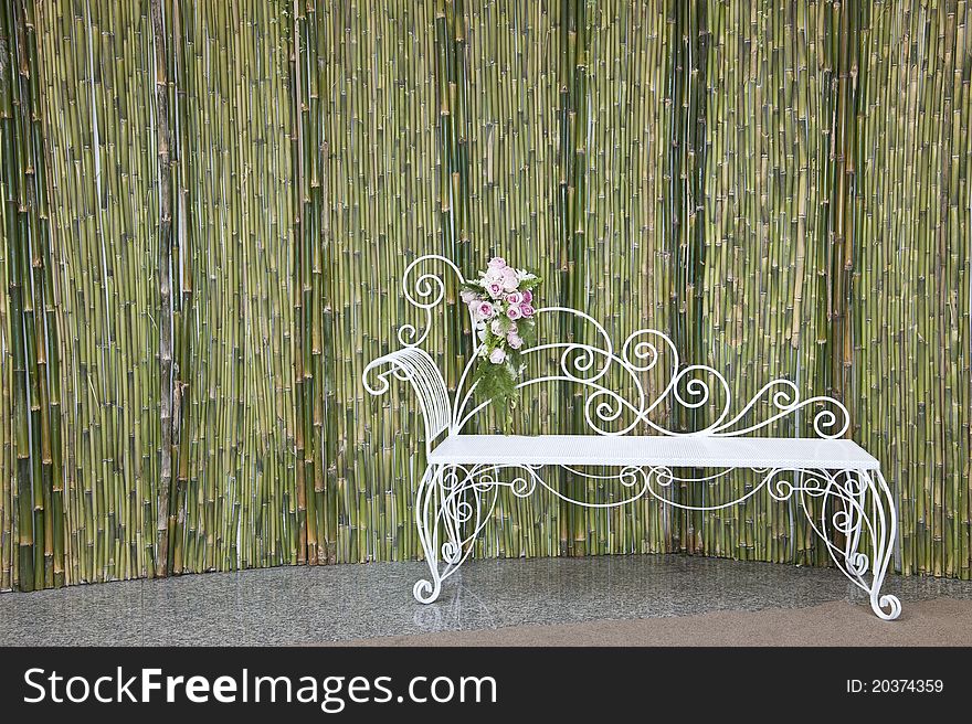 Bamboo wall with white bench. Bamboo wall with white bench