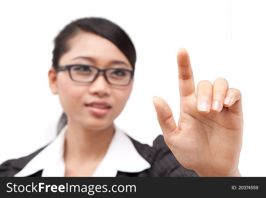 A portrait of Asia business woman. pressing her finger on touch screen