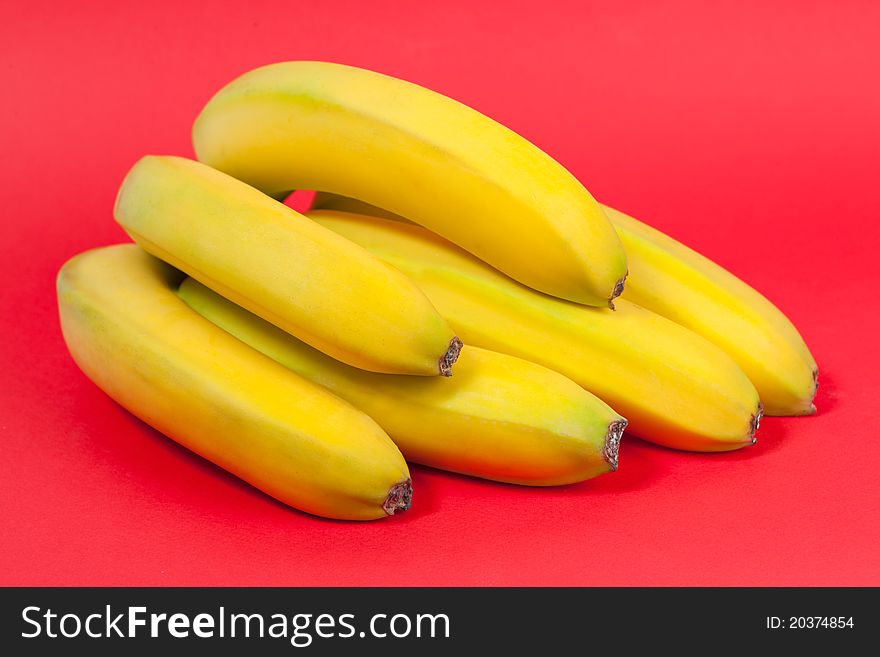 Bunch of bananas on red background