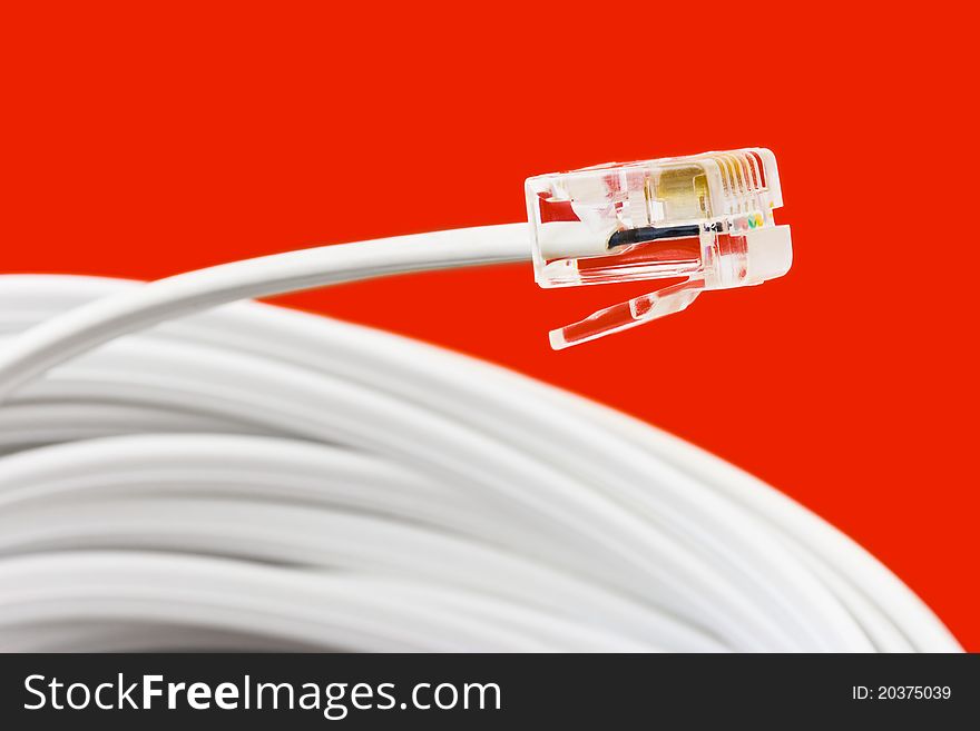 Macro of telephone cable - on red background. Macro of telephone cable - on red background