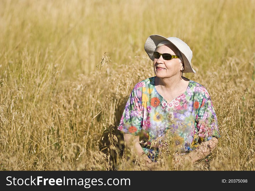 Woman in field with flowers. Woman in field with flowers