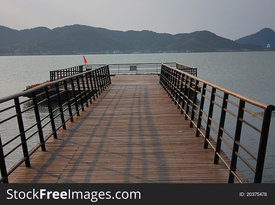 Dock and seascape at dusk