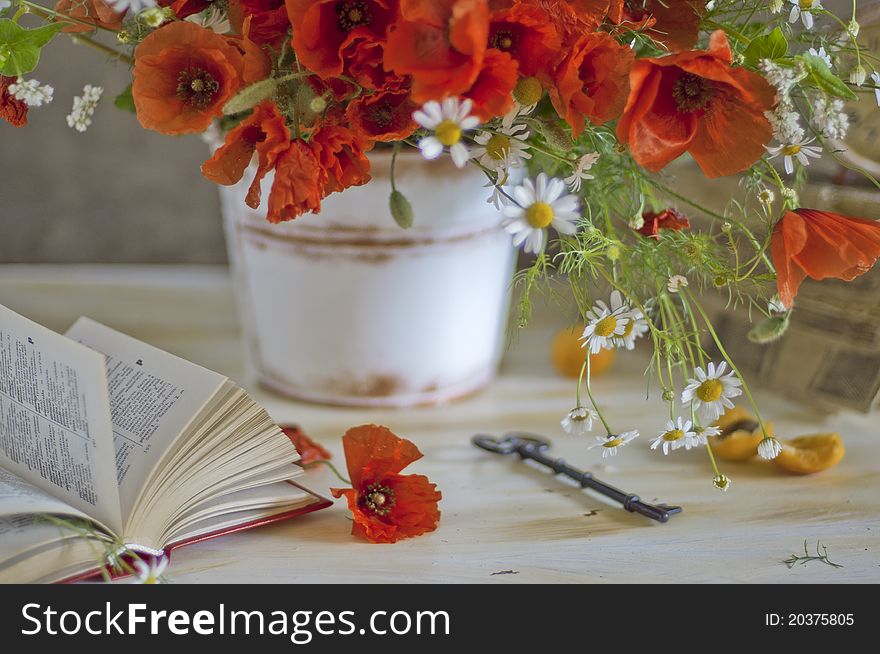 Bouquet poppy and camomiles and apricots