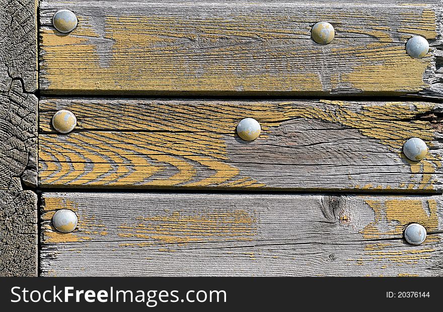 Old wooden panel with screws