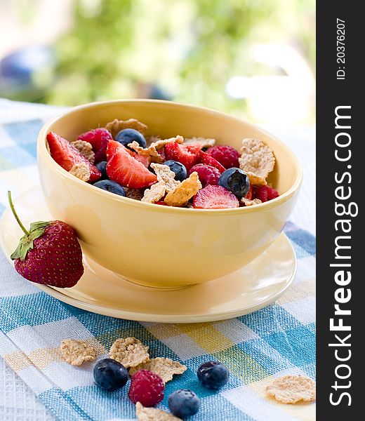 Corn flakes with fresh berries. Selective focus. Corn flakes with fresh berries. Selective focus